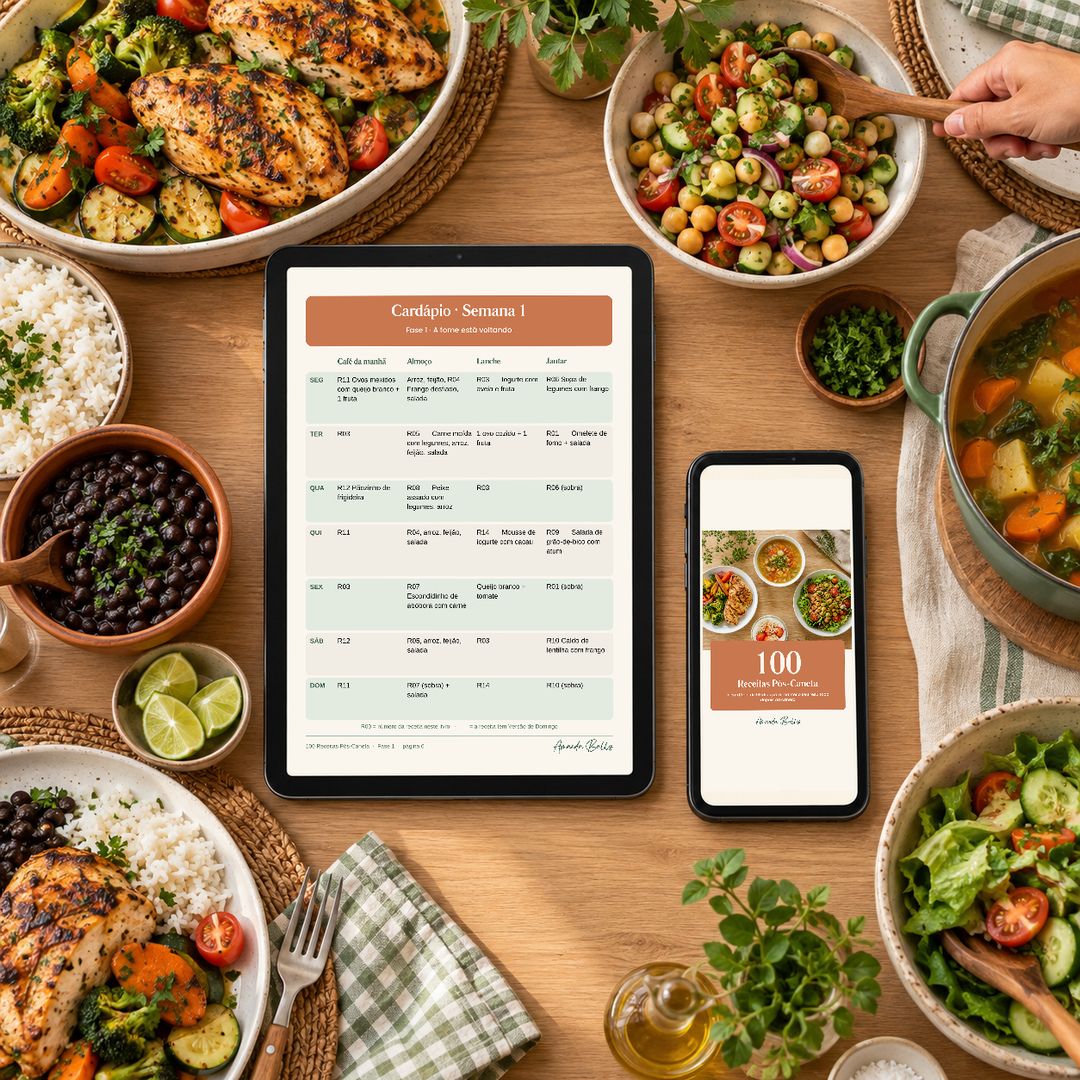 Livro 100 Receitas Pós-Caneta aberto no tablet sobre uma mesa de família servida